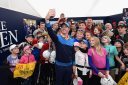 Rory McIlroy, shown with fans at the 2016 British Open