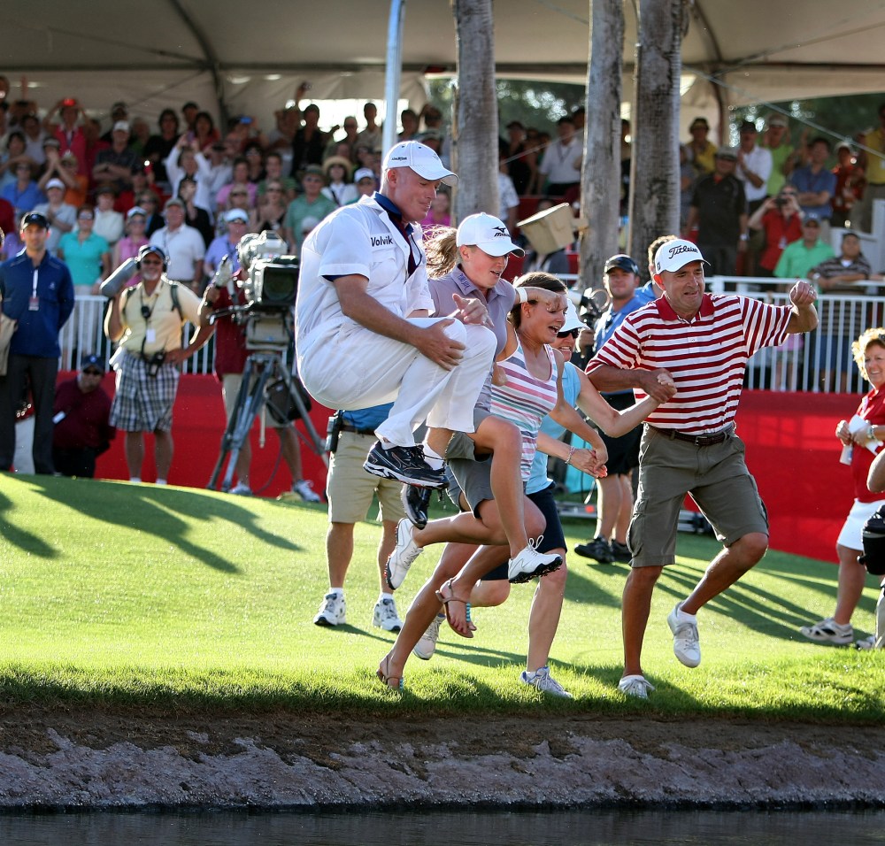 Stacy Lewis and her caddie, Travis Wilson, along with her sister, mom and dad, jump into Poppie's Pond.