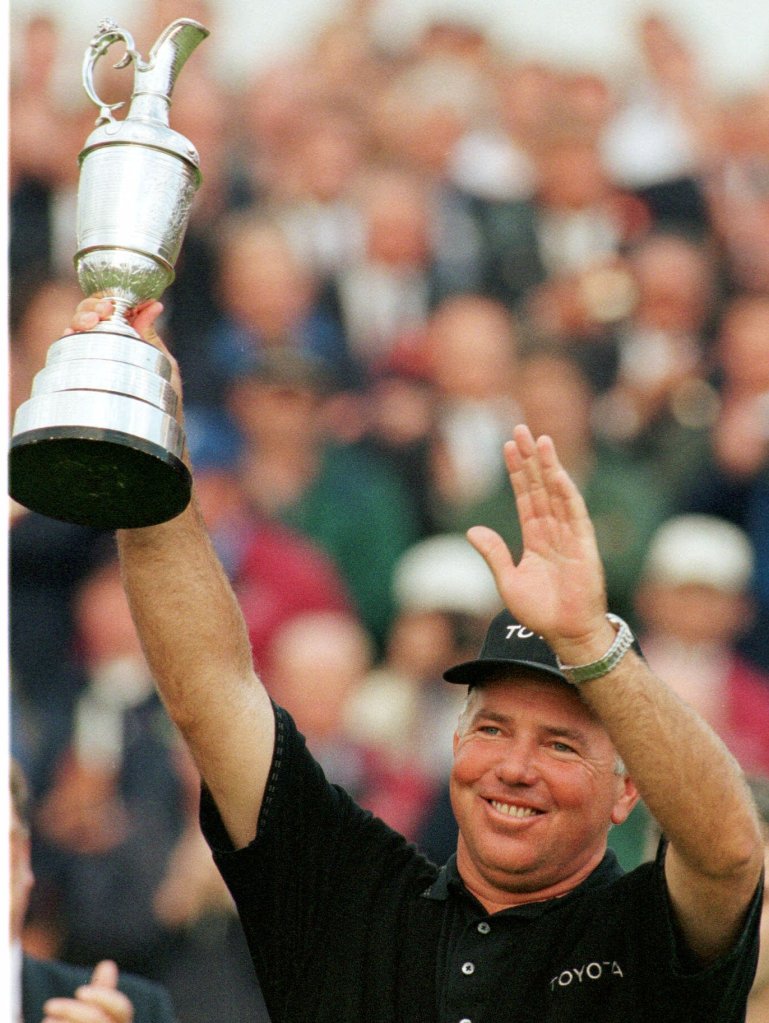 Mark O'Meara from the USA holds up the cup on the18th green, Sunday, July 19, 1998 at Royal Birkdale Golf Club, in Southport, in North West England after winning the 1998 British Open Golf Championships.