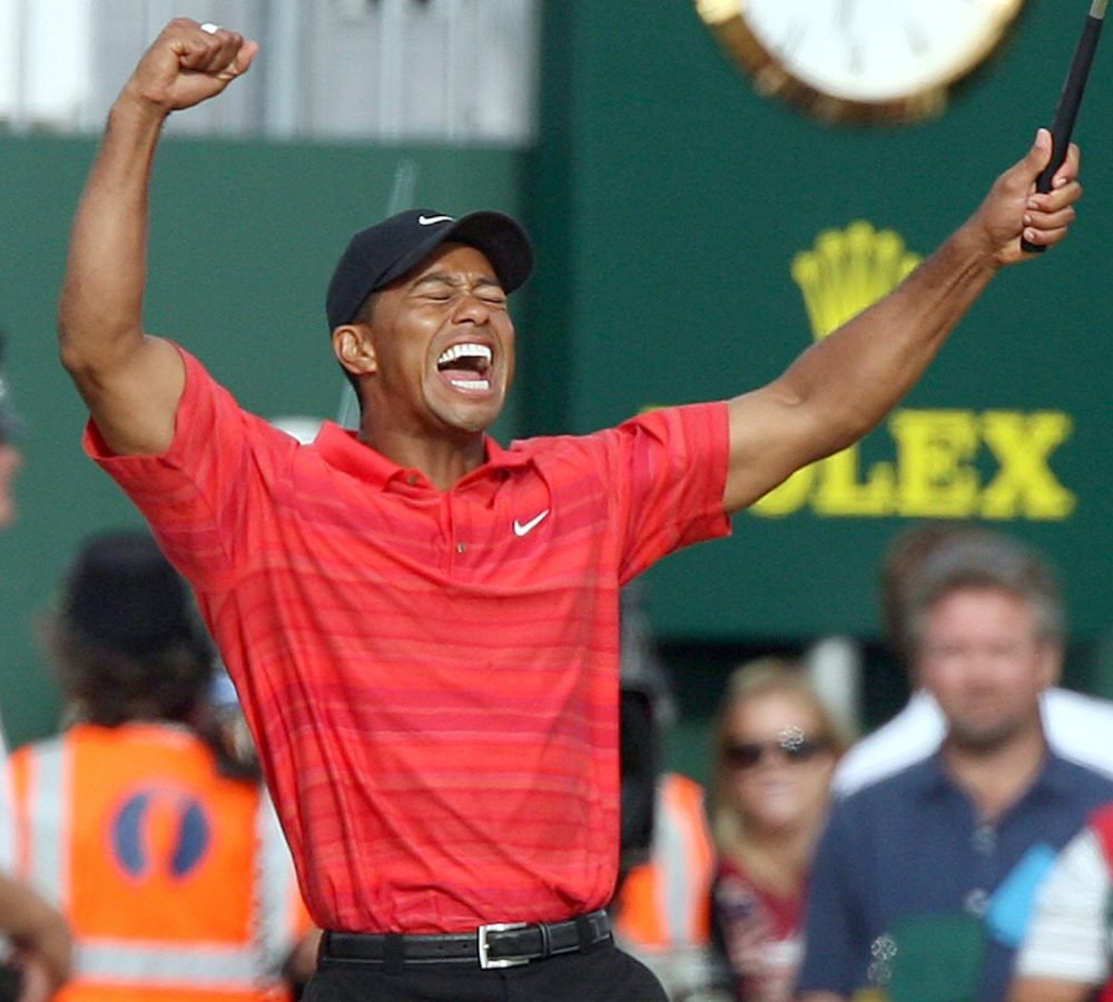 Tiger Woods of the United States celebrates after winning the British Open Golf Championship at the Royal Liverpool Golf Course in Hoylake, England Sunday July 23, 2006. 
