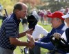 USA's Steve Stricker shakes hands with former President George H. W. Bush during a four-ball match at the Ryder Cup PGA golf tournament Saturday, Sept. 29, 2012, at the Medinah Country Club in Medinah, Ill.