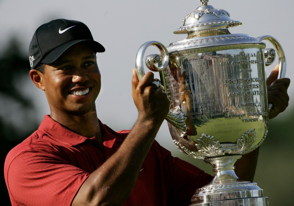 Tiger Woods holds up the Wanamaker Trophy after winning the 89th PGA Golf Championship at the Southern Hills Country Club in Tulsa, Okla., Sunday, Aug. 12, 2007. Woods won his 13th major tournament with an 8-under-par.