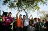 Seung-Yul Noh talks with rules official Steve Rintoul at No. 18 of Bay Hill Golf Club, where Noh's ball got stuck in a tree during the third round of the Arnold Palmer Invitational.