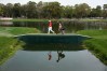 Mar 13, 2016; Palm Harbor, FL, USA; Graham Delaet walks across a bridge on the 12th hole during the final round of the Valspar Championship at Innisbrook Resort - Copperhead Course. Mandatory Credit: Rob Schumacher-USA TODAY Sports