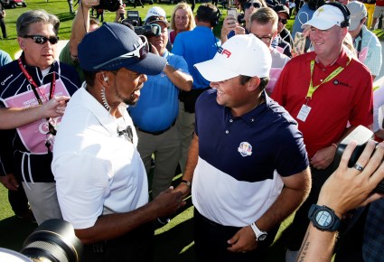 CHASKA, MN - OCTOBER 02: Vice-captain Tiger Woods celebrates with Patrick Reed of the United States after winning the Ryder Cup during singles matches of the 2016 Ryder Cup at Hazeltine National Golf Club on October 2, 2016 in Chaska, Minnesota. (Photo by Sam Greenwood/Getty Images)