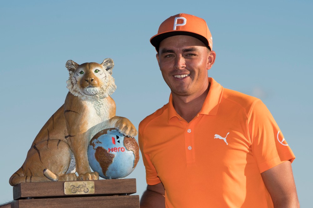 December 3, 2017; New Providence, The Bahamas; Rickie Fowler poses with the trophy after the final round of the Hero World Challenge golf tournament at Albany. Mandatory Credit: Kyle Terada-USA TODAY Sports