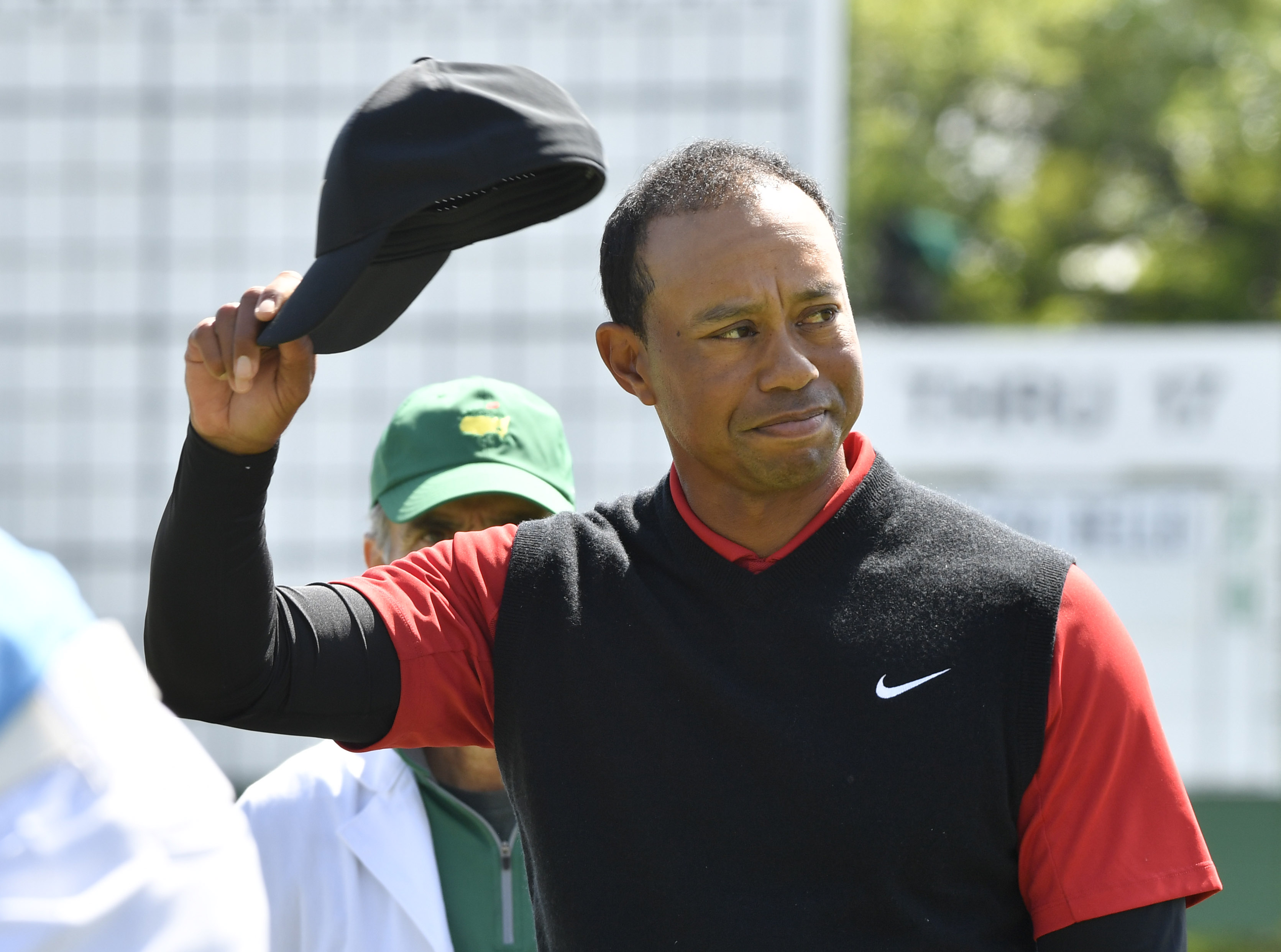 Apr 8, 2018; Augusta, GA, USA; Tiger Woods waves to the gallery after putting on the 18th green during the final round of the Masters golf tournament at Augusta National Golf Club. Mandatory Credit: Michael Madrid-USA TODAY Sports