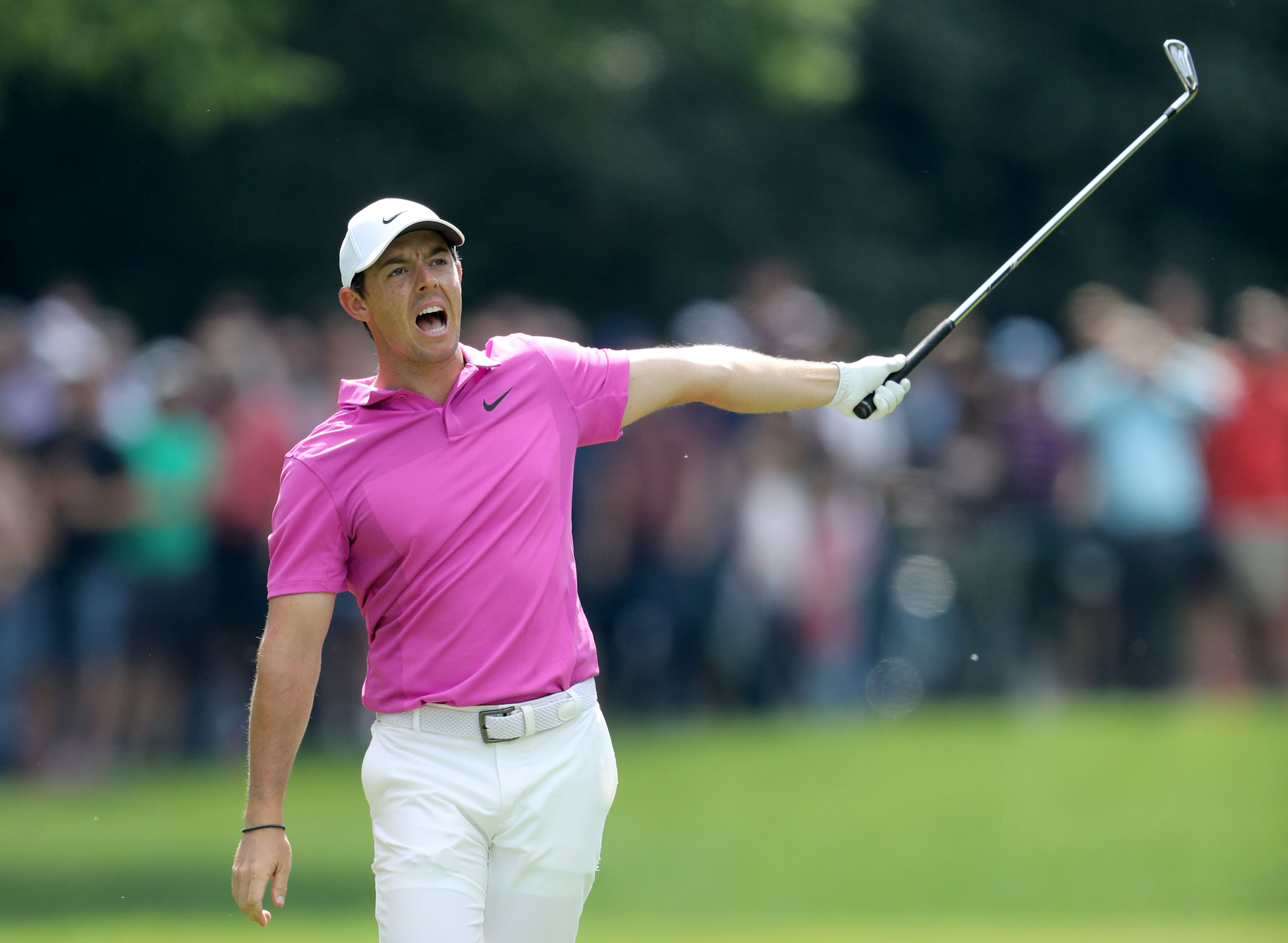 VIRGINIA WATER, ENGLAND - MAY 27: Rory McIlroy of Northern Ireland signals that his second shot has gone left towards the crowds on the par 5, 17th hole during the final round of the 2018 BMW PGA Championship on the West Course at Wentworth on May 27, 2018 in Virginia Water, England. (Photo by David Cannon/Getty Images)