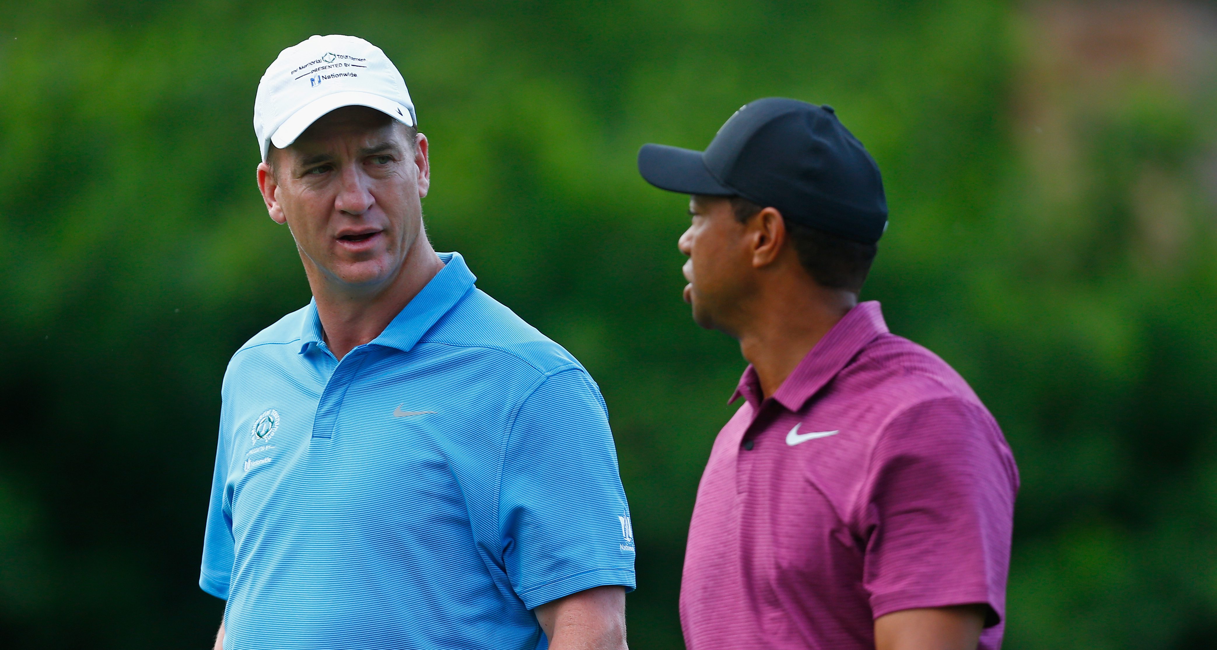 DUBLIN, OH - MAY 30: Former NFL player, Peyton Manning, speaks with Tiger Woods during the Pro-Am prior to The Memorial Tournament presented by Nationwide at Muirfield Village Golf Club on May 30, 2018 in Dublin, Ohio. (Photo by Matt Sullivan/Getty Images)