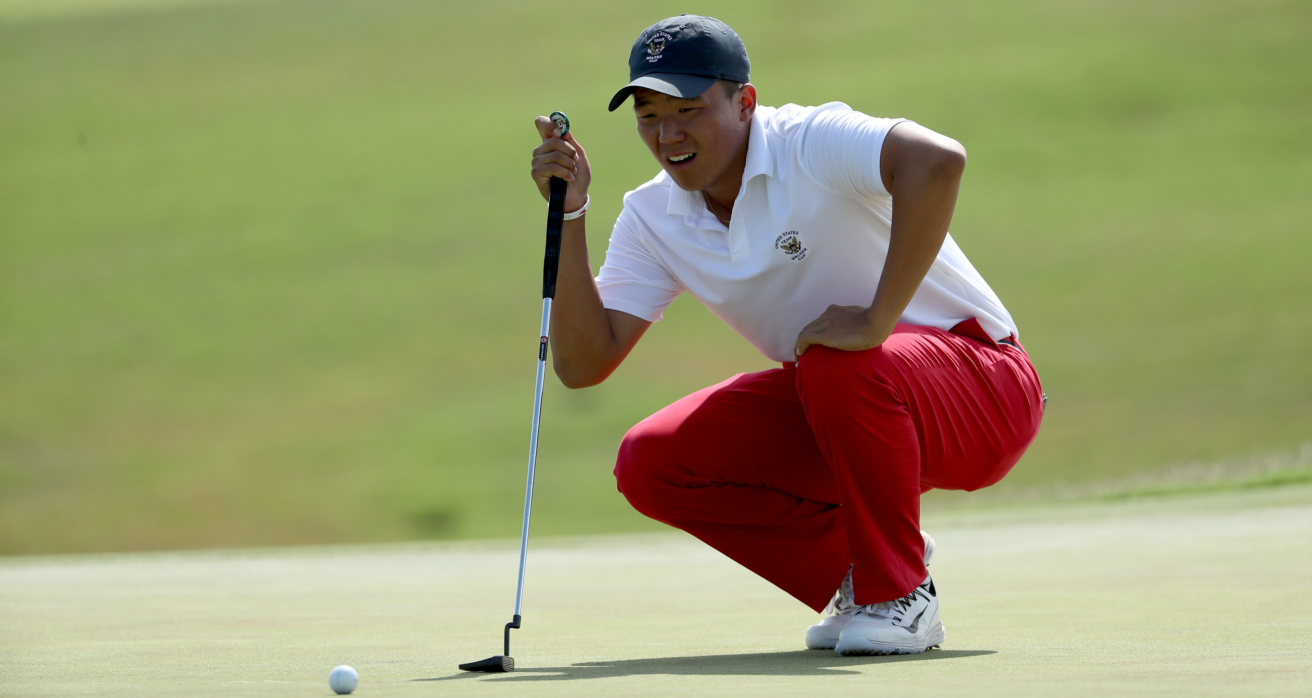 LOS ANGELES, CA - SEPTEMBER 10: Norman Xiong of the United States team lines up a putt on the 11th hole in his match against Scott Gregory of the Great Britain and Ireland team during the afternoon singles matches in the 2017 Walker Cup at the Los Angeles Country Club on September 10, 2017 in Los Angeles, California. (Photo by David Cannon/R&A/R&A via Getty Images )