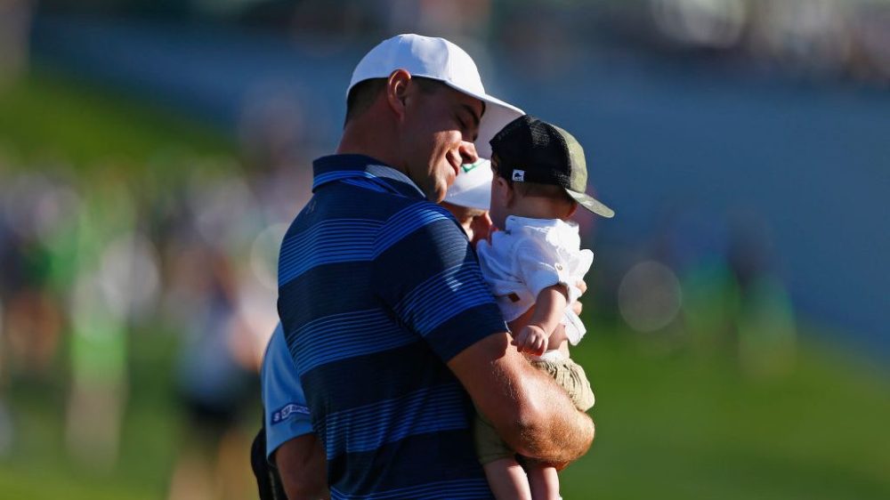SCOTTSDALE, AZ - FEBRUARY 04: Gary Woodland holds his son, Jaxson, after winning the Waste Management Phoenix Open at TPC Scottsdale on February 4, 2018 in Scottsdale, Arizona. (Photo by Matt Sullivan/Getty Images)