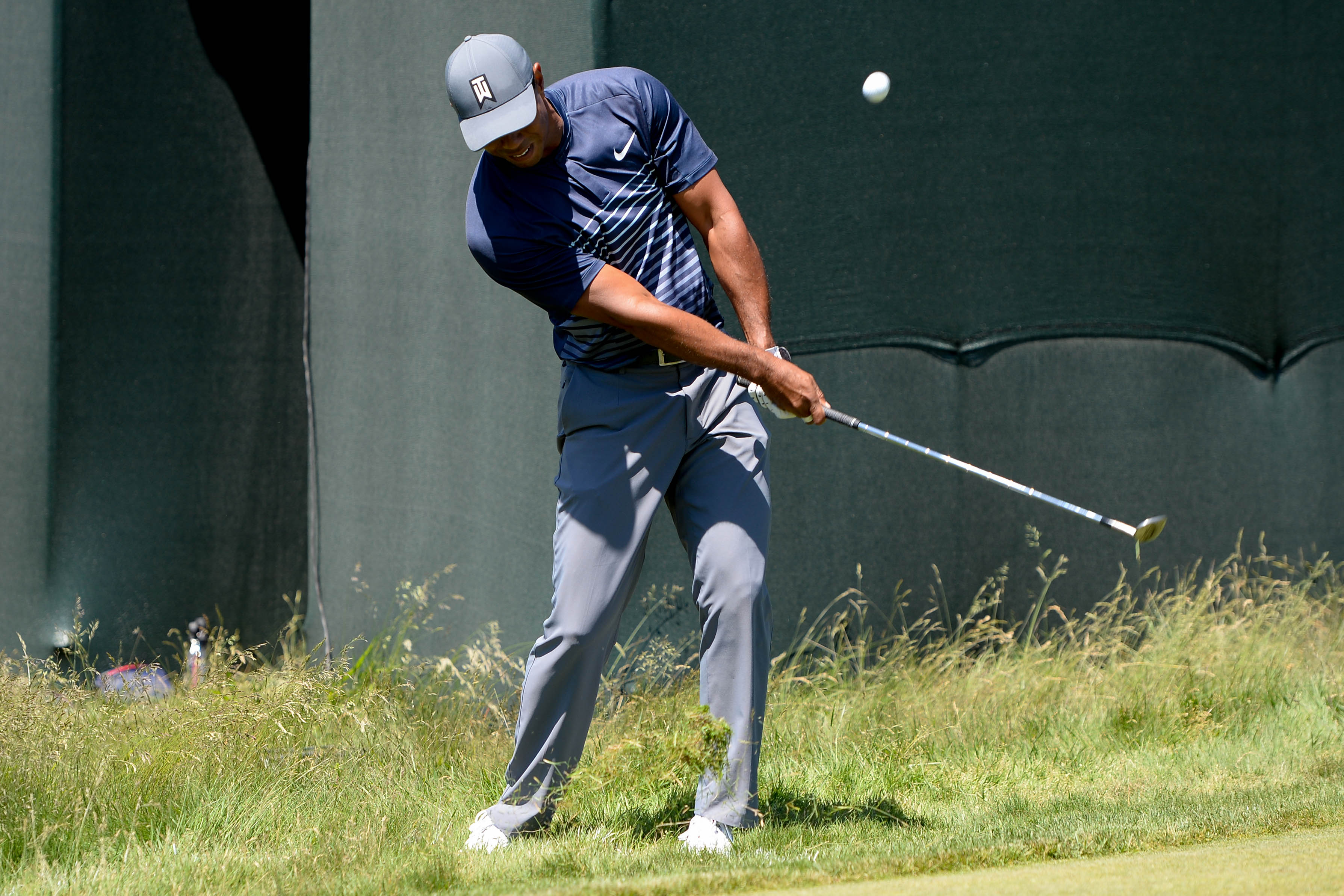 Jun 14, 2018; Southampton, NY, USA; Tiger Woods hits onto the first green during the first round of the U.S. Open golf tournament at Shinnecock Hills GC - Shinnecock Hills Golf C. Mandatory Credit: Dennis Schneidler-USA TODAY Sports