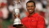 An emotional Tiger Woods of the United States poses with the Claret Jug after winning the 135th British Open Golf Championships in Hoylake, in Liverpool, in north-west England, 23 July 2006. AFP PHOTO/JOHN D MCHUGH (Photo credit should read JOHN D MCHUGH/AFP/Getty Images)