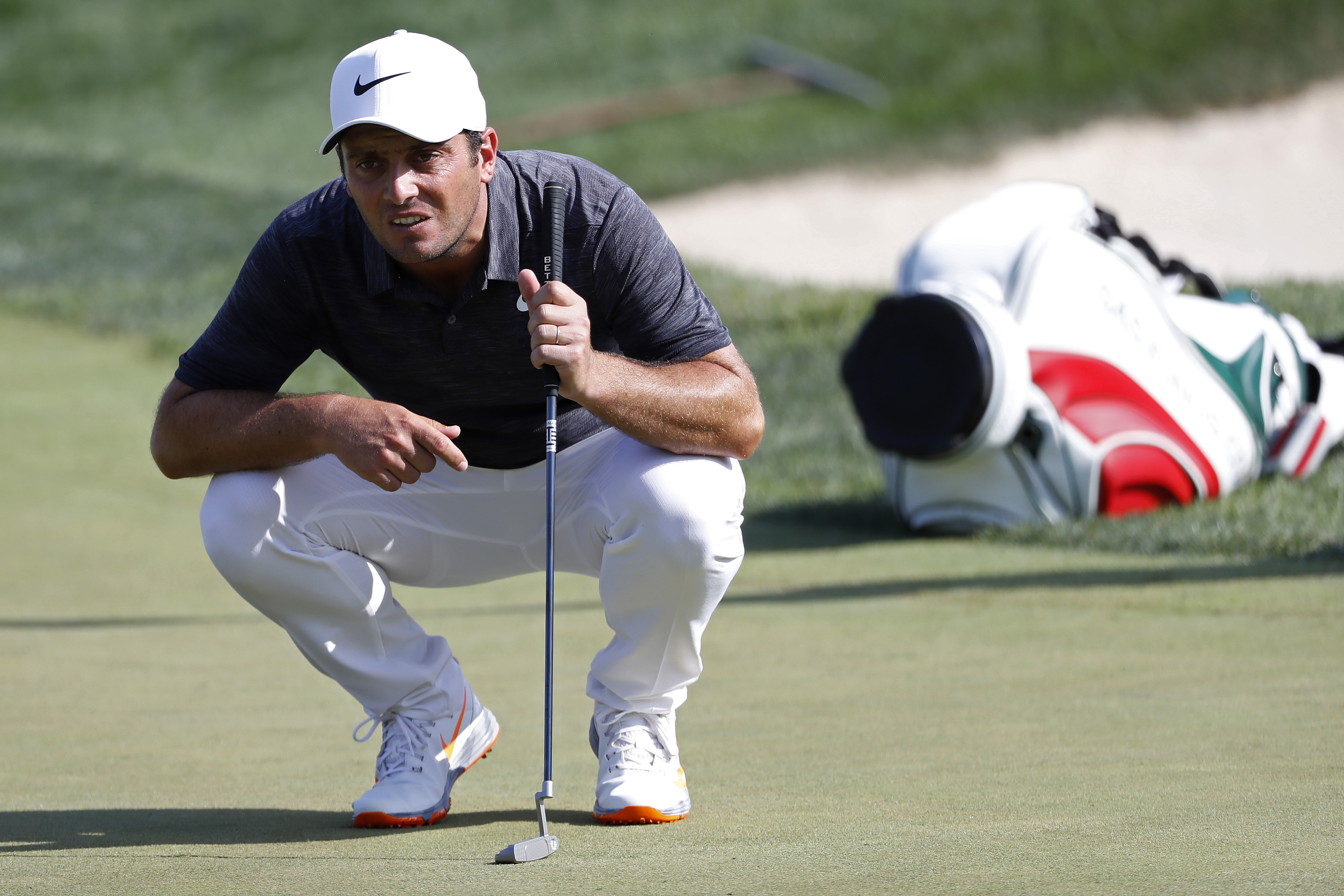 Jun 30, 2018; Potomac, MD, USA; Francesco Molinari of Italy lines up a putt on the 16th hole during the third round of The National golf tournament at TPC Potomac at Avenel Farm. Mandatory Credit: Geoff Burke-USA TODAY Sports