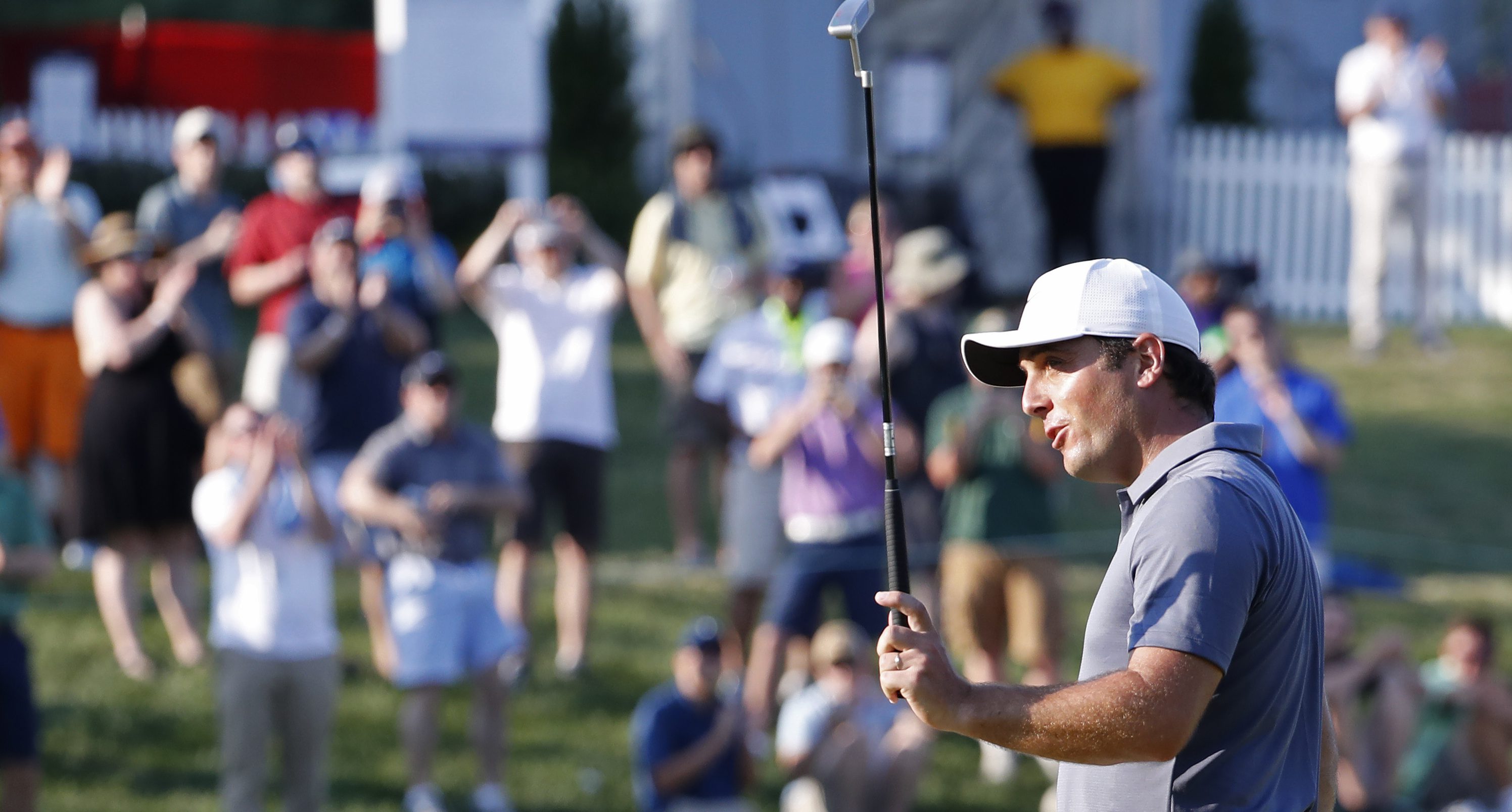 Jul 1, 2018; Potomac, MD, USA; Francesco Molinari of Italy celebrates on the 18th hole after winning the Quicken Loans National golf tournament at TPC Potomac at Avenel Farm. Mandatory Credit: Geoff Burke-USA TODAY Sports