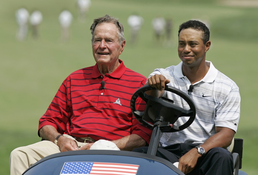 BETHESDA, MD - JULY 4: Former President George H.W. Bush (L) and Tiger Woods (R) drive to the first tee for the Opening Ceremony of the AT&T National at Congressional Country Club on July 4, 2007 in Bethesda, Maryland. (Photo by Hunter Martin/WireImage)
