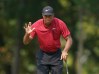 Aug 12, 2018; Saint Louis, MO, USA; Tiger Woods waves to the crowd on the 9th green during the final round of the PGA Championship golf tournament at Bellerive Country Club. Mandatory Credit: Kyle Terada-USA TODAY Sports