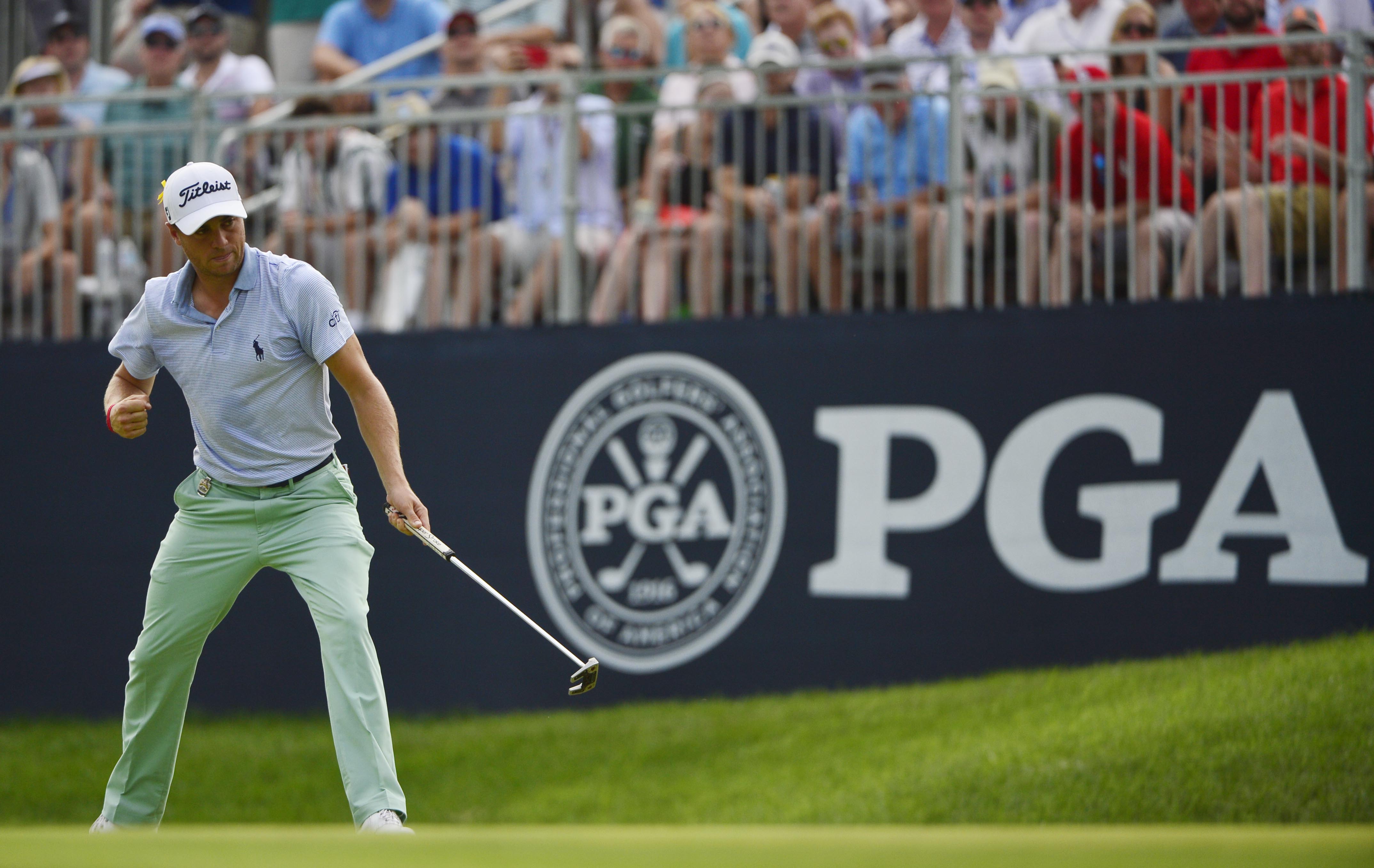 Aug 12, 2018; Saint Louis, MO, USA; Justin Thomas pumps his fist after making a birdie putt on the 10th green during the final round of the PGA Championship golf tournament at Bellerive Country Club. Mandatory Credit: Jeff Curry-USA TODAY Sports