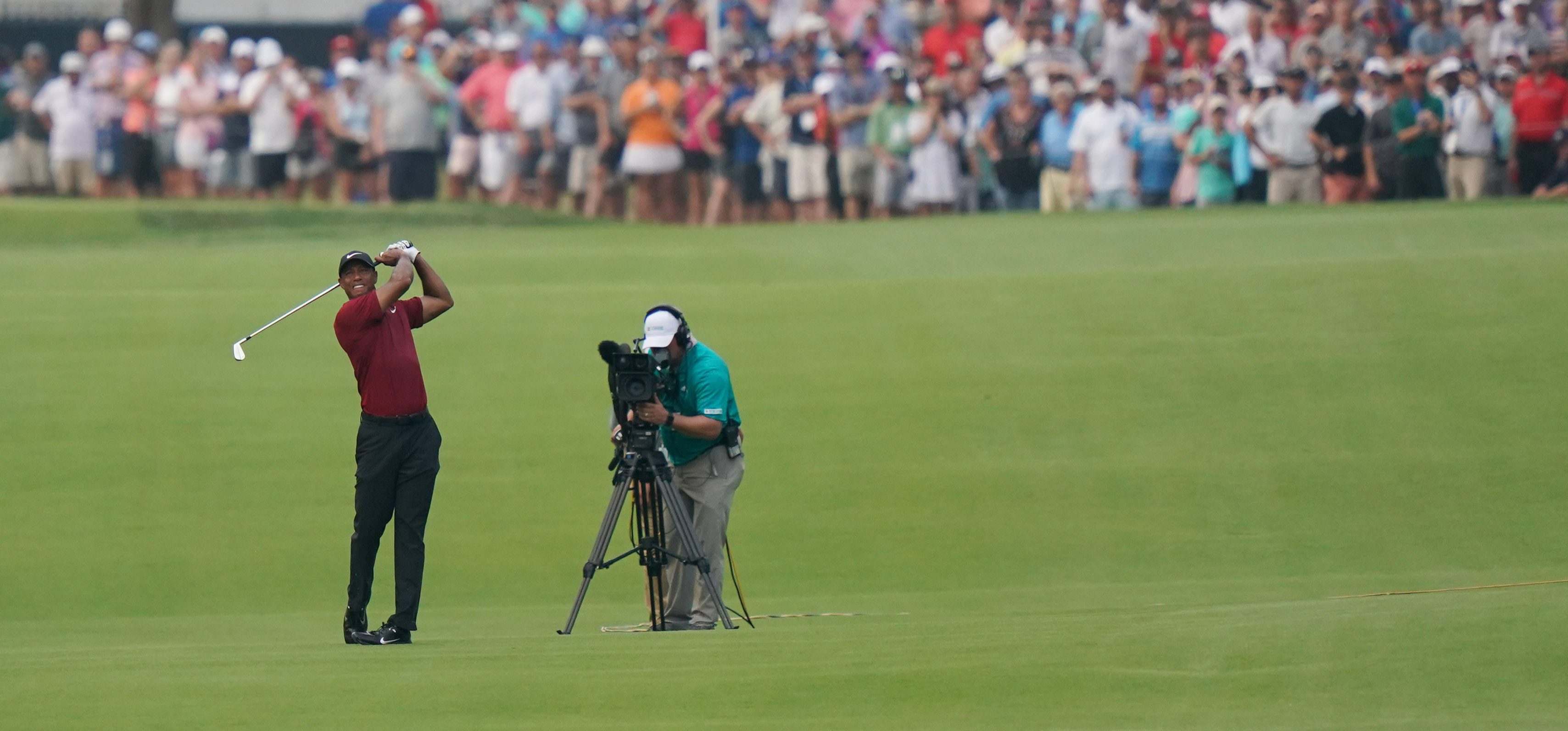 Aug 12, 2018; Saint Louis, MO, USA; Tiger Woods hits from the fairway on the 17th hole during the final round of the PGA Championship golf tournament at Bellerive Country Club. Mandatory Credit: Kyle Terada-USA TODAY Sports