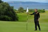 NAIRN, SCOTLAND - AUGUST 19 : Falko Hanisch of Germany tends the pin flag at the 14th green during the Semi Final match at the Boys Amateur Championship at Nairn Golf Club on August 19, 2017 in Nairn, Scotland. (Photo by Mark Runnacles/R&A/R&A via Getty Images)
