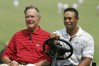 BETHESDA, MD - JULY 4: Former President George H.W. Bush (L) and Tiger Woods (R) drive to the first tee for the Opening Ceremony of the AT&T National at Congressional Country Club on July 4, 2007 in Bethesda, Maryland. (Photo by Hunter Martin/WireImage)