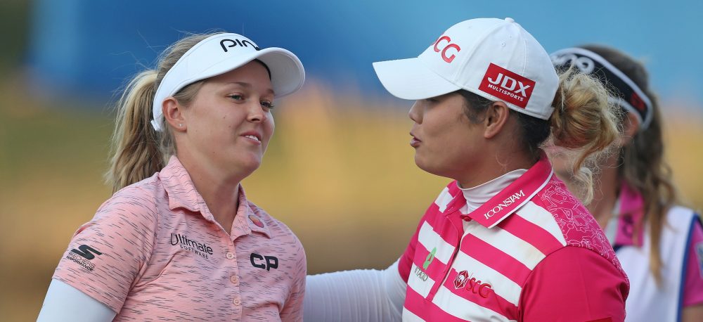 LAKE BUENA VISTA, FLORIDA - JANUARY 19: Brooke Henderson of Canada hugs Ariya Jutanugarn of Thailand on the 18th hole during the third round of the Diamond Resorts Tournament of Champions at Tranquilo Golf Course at Four Seasons Golf and Sports Club Orlando on January 19, 2019 in Lake Buena Vista, Florida. (Photo by Matt Sullivan/Getty Images)