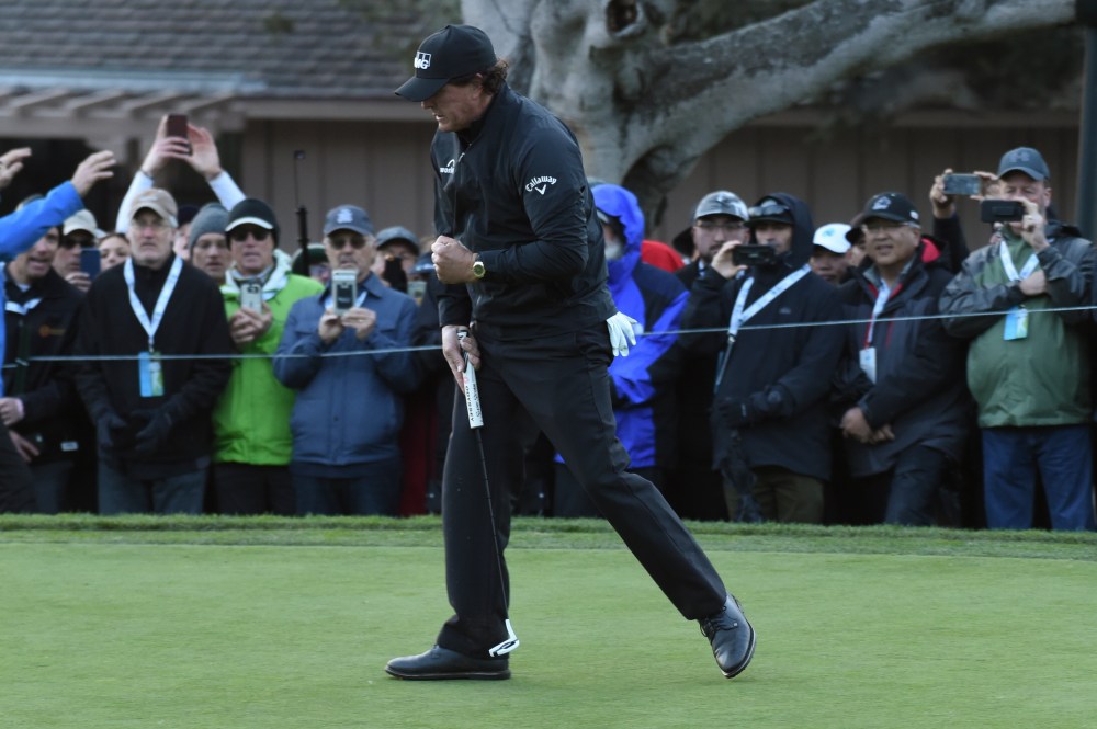 EDITORS NOTE: CAPTION CORRECTION Feb 10, 2019; Pebble Beach, CA, USA; Phil Mickelson celebrates his birdie at the 15th hole during the final round of the AT&T Pebble Beach Pro-Am golf tournament at Pebble Beach Golf Links. Mandatory Credit: Michael Madrid-USA TODAY Sports