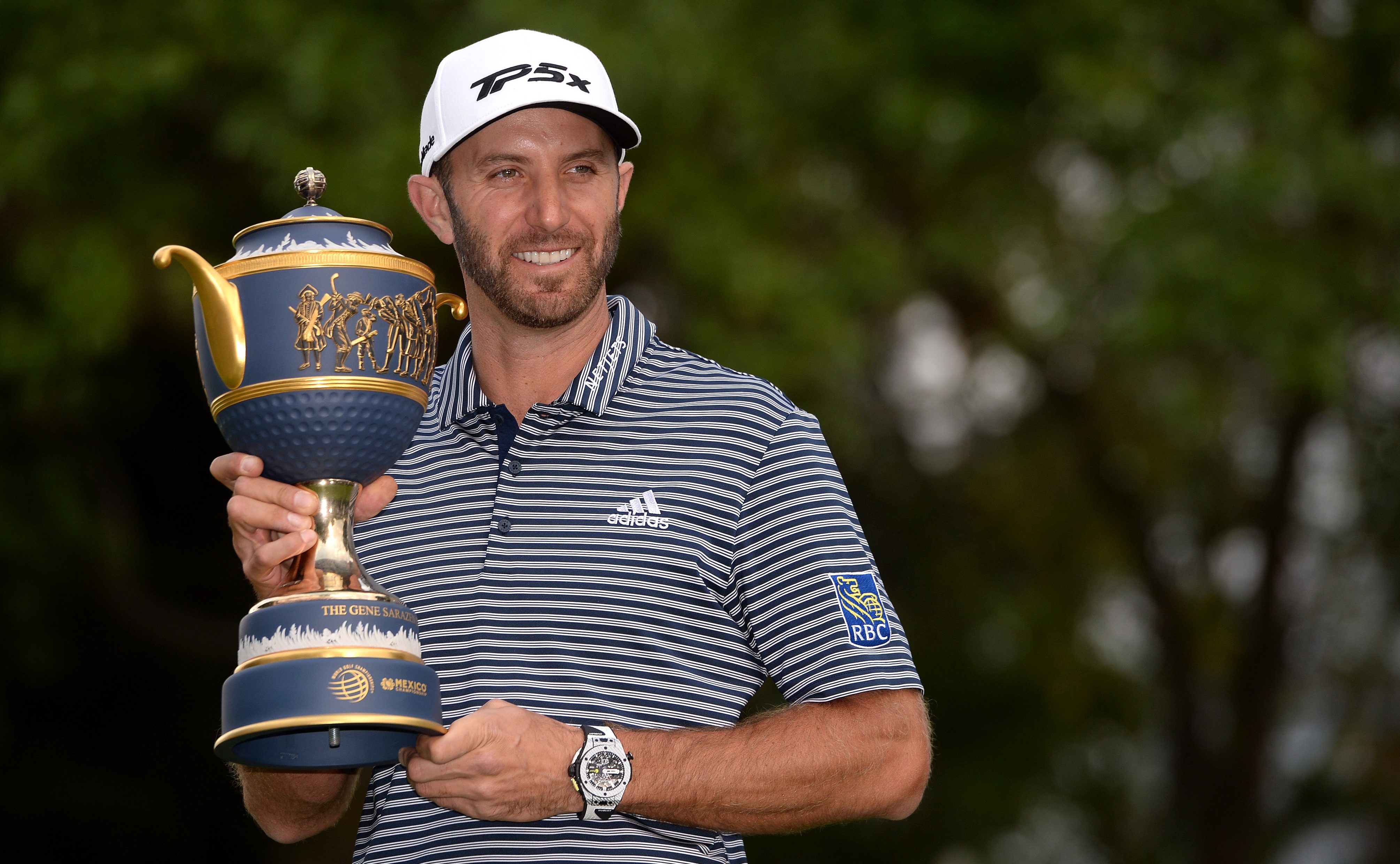 Feb 24, 2019; Mexico City, MEX; Dustin Johnson poses for a photo with the trophy after winning the final round of the WGC - Mexico Championship golf tournament at Club de Golf Chapultepec. Mandatory Credit: Orlando Ramirez-USA TODAY Sports