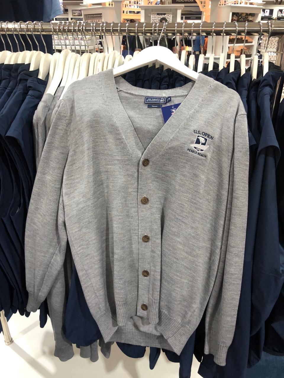 Vineyard Vines’ Jim Nantz Collection is headlined by this Arnold Palmer-inspired Merino wool cardigan, $175 in heather gray only since it is Pebble Beach and grey days do outnumber the sunny ones.