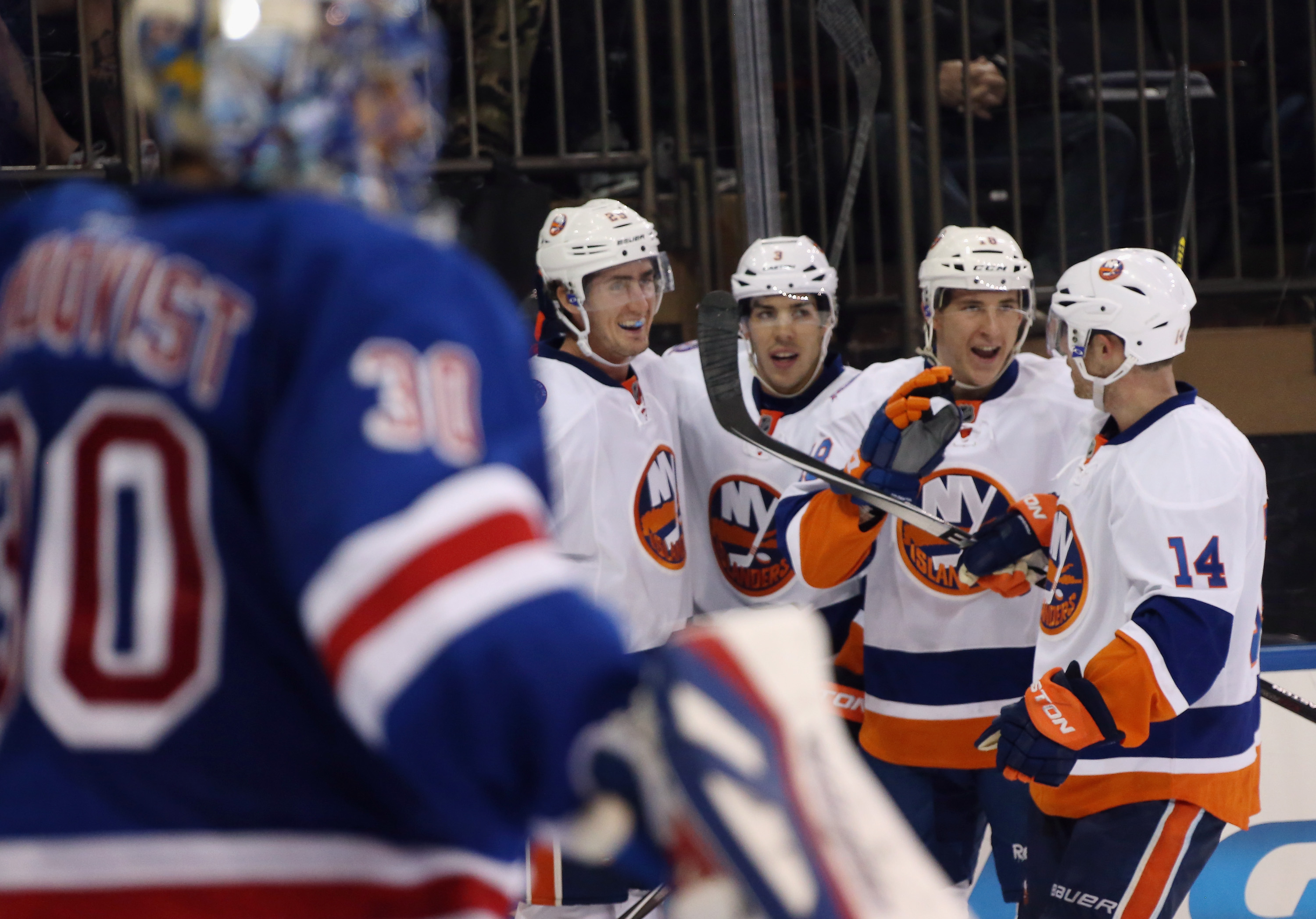The Islanders celebrate a Brock Nelson goal against Henrik Lundqvist. (Bruce Bennett, Getty Images)