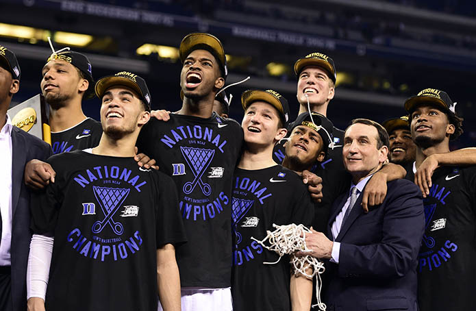 Duke Blue Devils head coach Mike Krzyzewski and his players including Quinn Cook watch "One Shining Moment" after defeating the Wisconsin Badgers in the 2015 NCAA Men's Division I Championship game at Lucas Oil Stadium. (USA TODAY Sports)