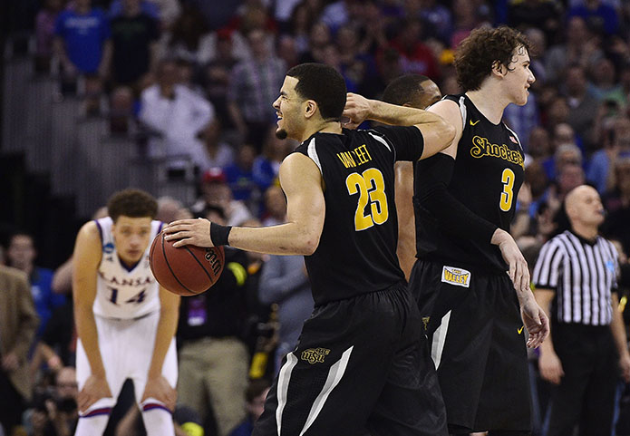 Wichita State Shockers guard Fred VanVleet (23) and guard Evan Wessel (3) celebrate during the second half in the third round of the 2015 NCAA Tournament against the Kansas Jayhawks at CenturyLink Center. (USA TODAY Sports)