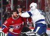 Brandon Prust, left, and Braydon Coburn fight in the third period. (Jean-Yves Ahern, USA TODAY Sports)