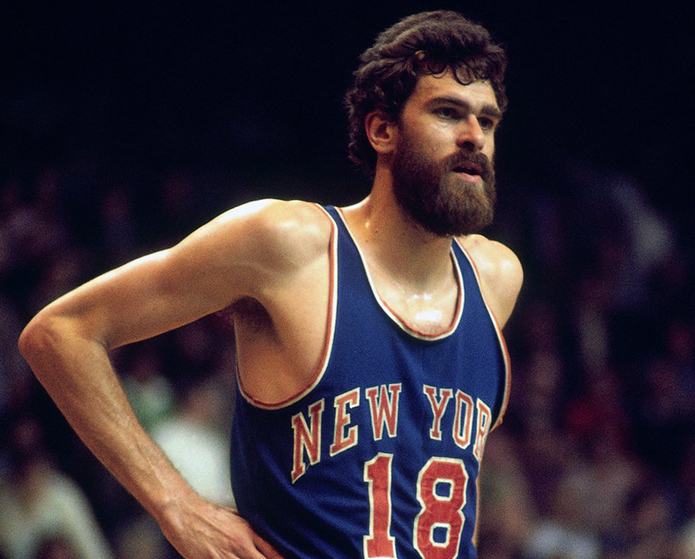 BOSTON - 1974:  Phil Jackson #18 of the New York Knicks looks on during a game against the Boston Celtics played in 1974 at the Boston Garden in Boston, Massachusetts. NOTE TO USER: User expressly acknowledges and agrees that, by downloading and or using this photograph, User is consenting to the terms and conditions of the Getty Images License Agreement. Mandatory Copyright Notice: Copyright 1974 NBAE (Photo by Dick Raphael/NBAE via Getty Images)