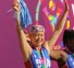Olivia strikes the signature Special Olympics pose. (Aaron Mills/Special Olympics USA)