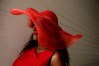 LOUISVILLE, KY - MAY 07: A woman wearing a festive hat looks on prior to the 142nd running of the Kentucky Derby at Churchill Downs on May 07, 2016 in Louisville, Kentucky. (Photo by Andy Lyons/Getty Images) ORG XMIT: 614259857 ORIG FILE ID: 528932732