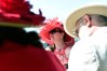 LOUISVILLE, KY - MAY 07: A woman wearing a festive hat looks on prior to the 142nd running of the Kentucky Derby at Churchill Downs on May 07, 2016 in Louisville, Kentucky. (Photo by Logan Riely/Getty Images) ORG XMIT: 614259857 ORIG FILE ID: 528932740