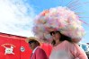 LOUISVILLE, KY - MAY 07: A man and woman wearing festive hats walk the grounds prior to the 142nd running of the Kentucky Derby at Churchill Downs on May 07, 2016 in Louisville, Kentucky. (Photo by Logan Riely/Getty Images) ORG XMIT: 614259857 ORIG FILE ID: 528932846