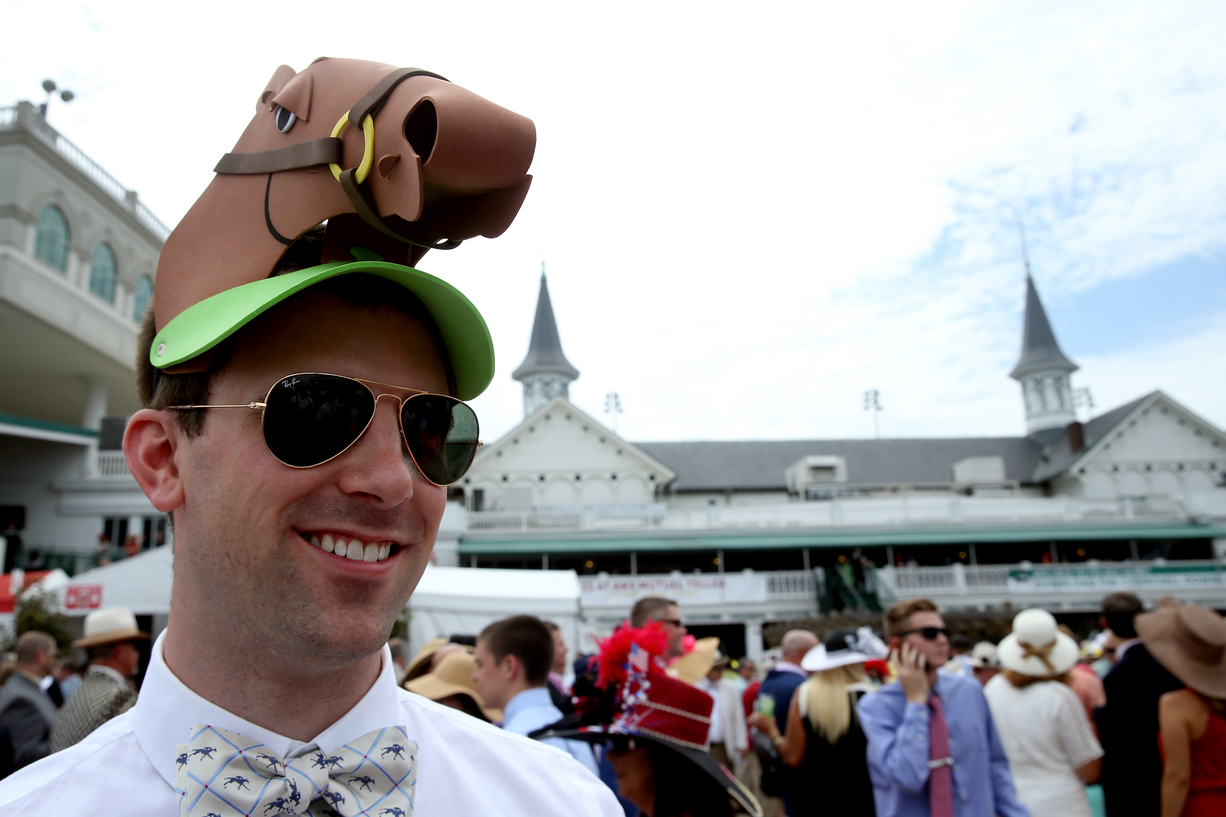 LOUISVILLE, KY - MAY 07: A man wearing a festive hat looks on prior to the 142nd running of the Kentucky Derby at Churchill Downs on May 07, 2016 in Louisville, Kentucky. (Photo by Andy Lyons/Getty Images) ORG XMIT: 614259857 ORIG FILE ID: 528932876