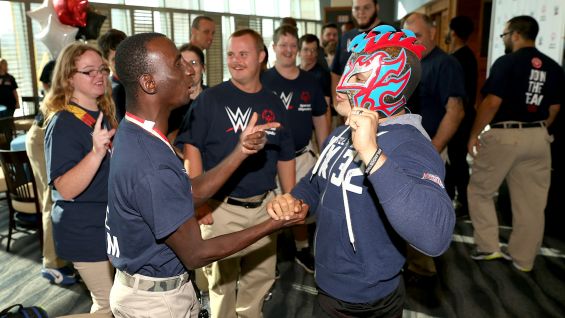 Lonnie engaging with WWE Superstar Kalisto at an event celebrating the launch of the partnership at the WWE Performance Center in Orlando.