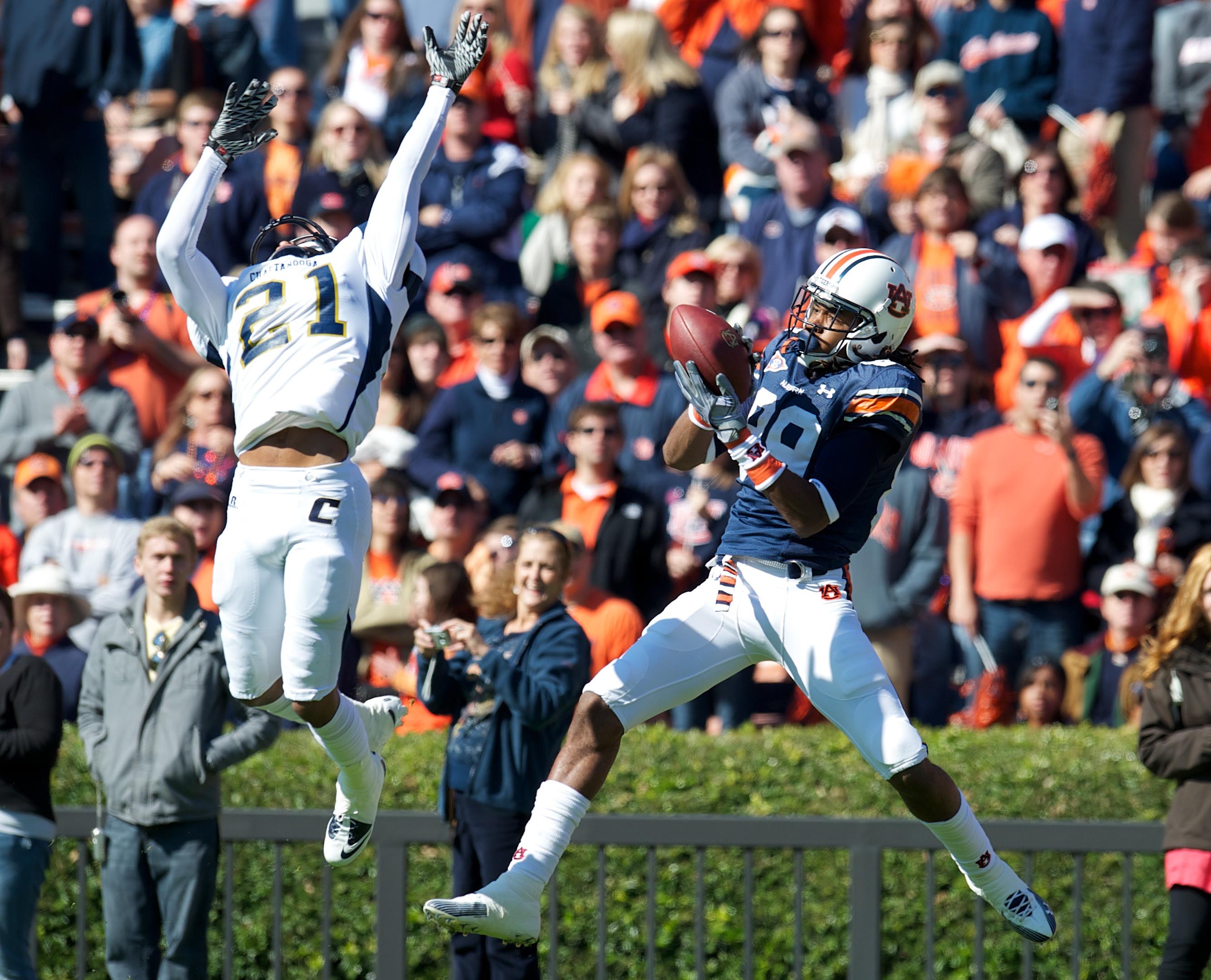 ORG XMIT: USPW-51110738AL Nov 6, 2010; Auburn, AL, USA; Auburn Tigers wide receiver Darvin Adams (89) catches a touchdown pass over the reach of Chattanooga Mocs cornerback Buster Skrine (21) in the first quarter at Jordan-Hare Stadium. Mandatory Credit: Dale Zanine-US PRESSWIRE ORIG FILE ID: 20101106_jel_sz2_036.jpg