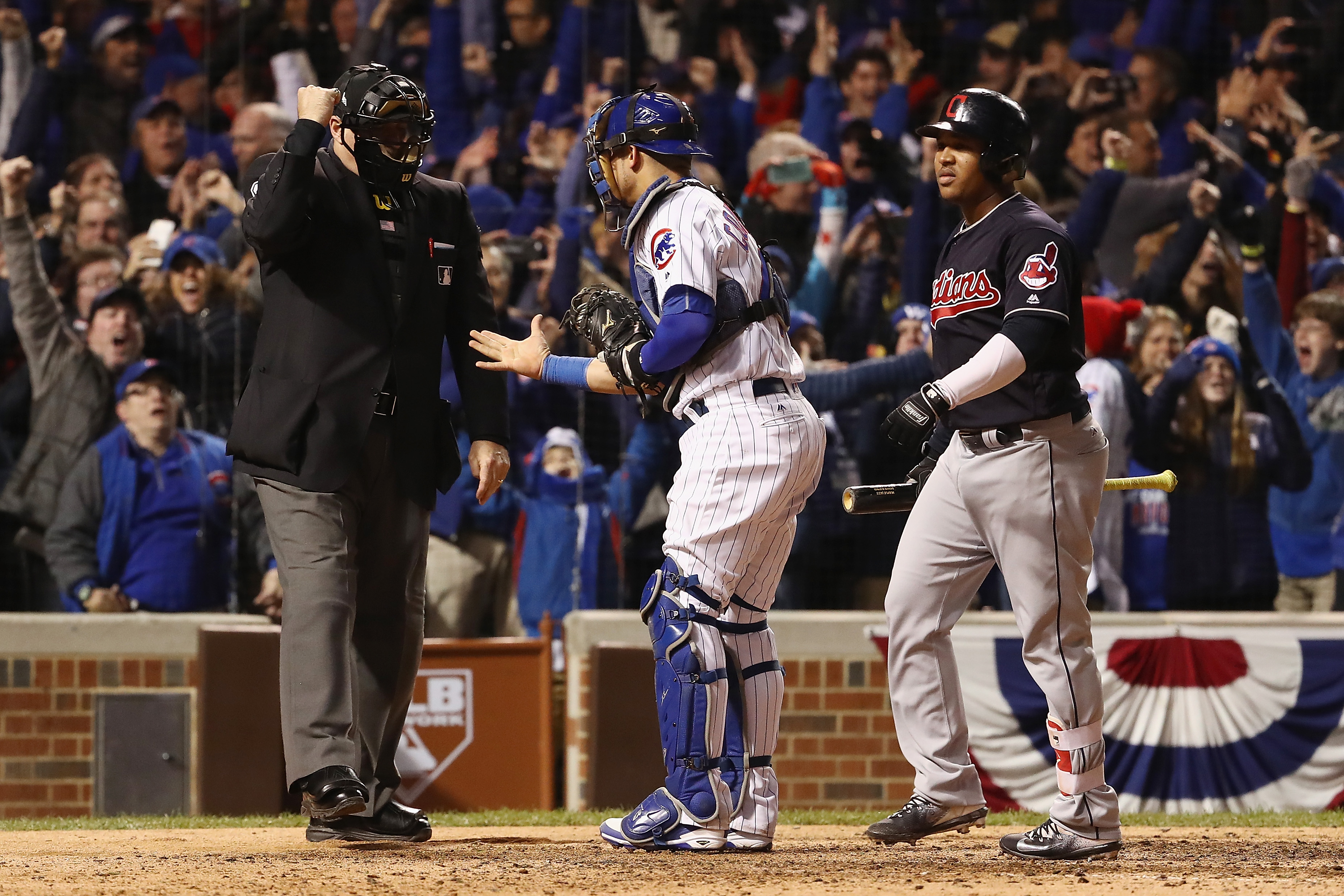 (Umpire Tony Randazzo (left) with Willson Contreras and Jose Ramirez. (Photo by Elsa/Getty Images) 